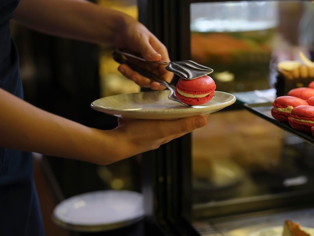 Red macarons served in a patisserie