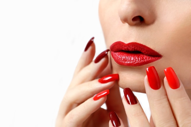 Red makeup and manicure on long nails