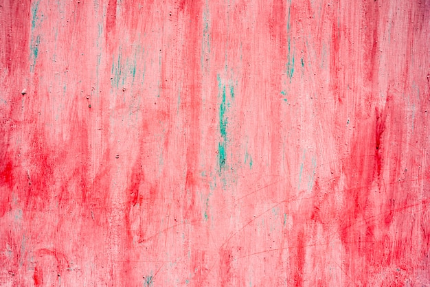 Red metal background painted in red with scratches