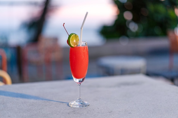 Red mocktail glass at the outdoor place in Thailand resort.