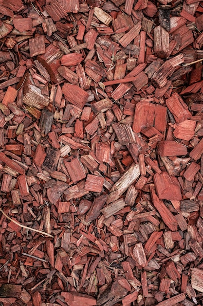 Red mulch. Protection of the soil from drying out, cold weather, weeds. Background from wood chips.