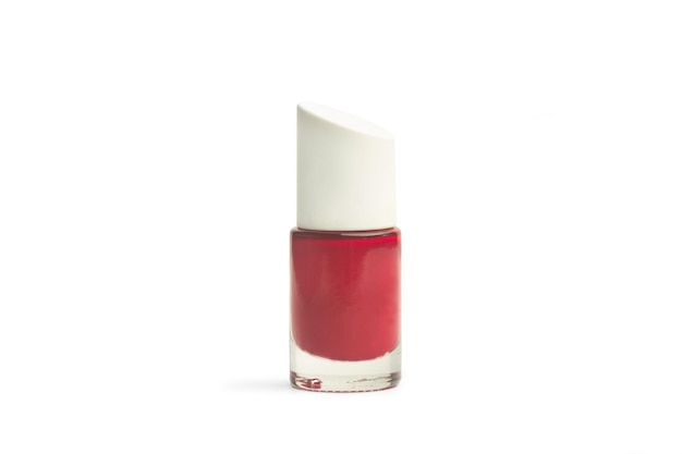 Red nail polish bottle on a white background with copy space
