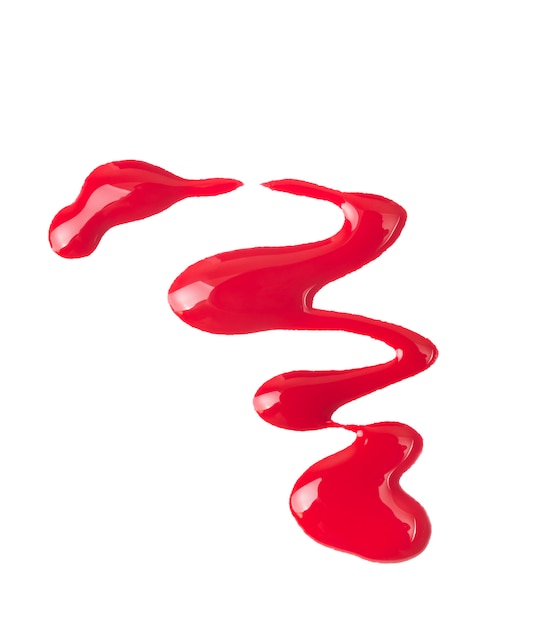 Photo red nail polish (enamel) drops sample, isolated on white