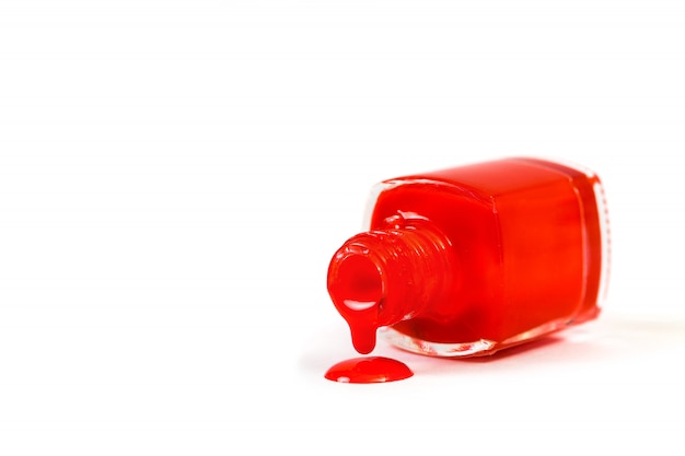 Red nail Polish spilled isolated on white background