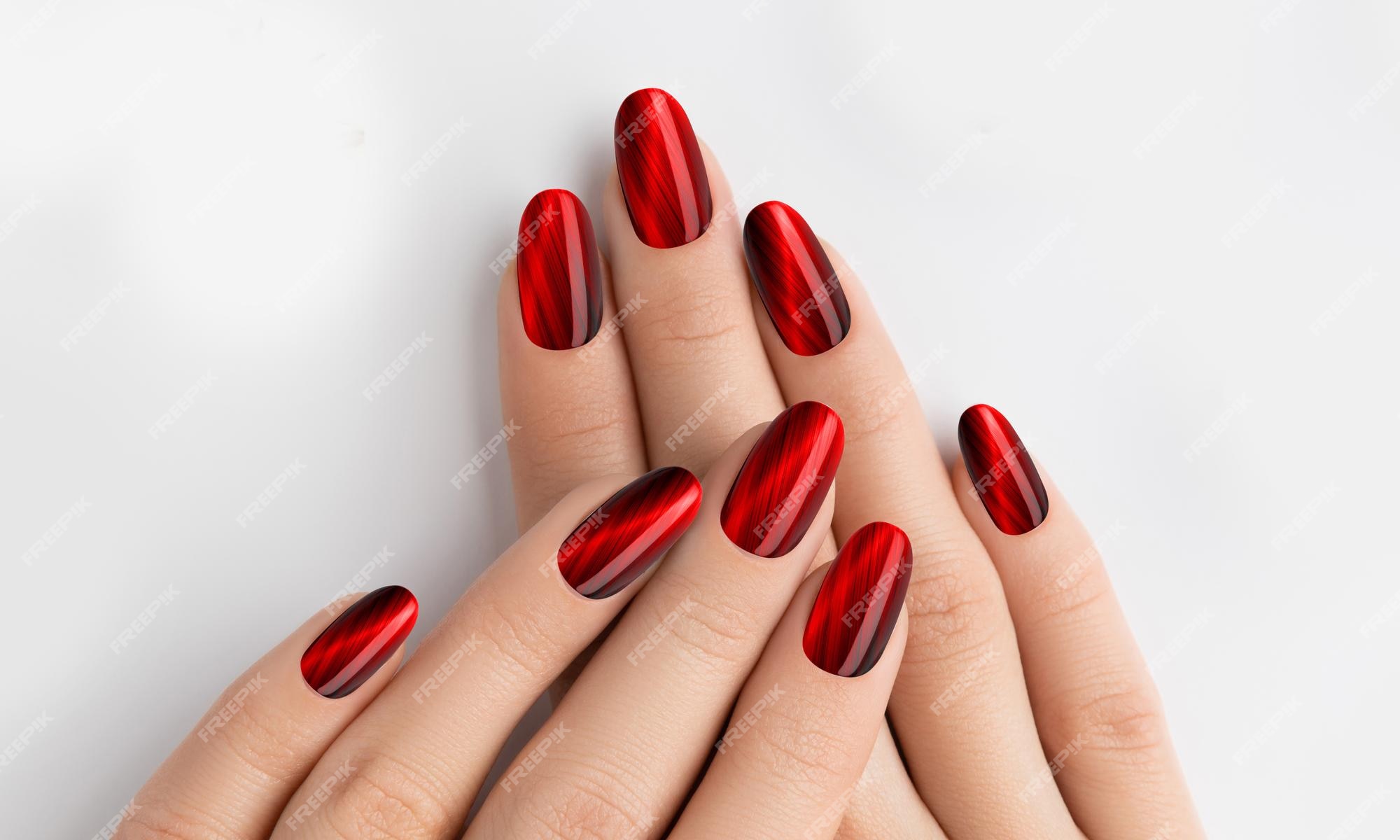 Premium Photo | Red on nails young lady hands with manicured nail ...