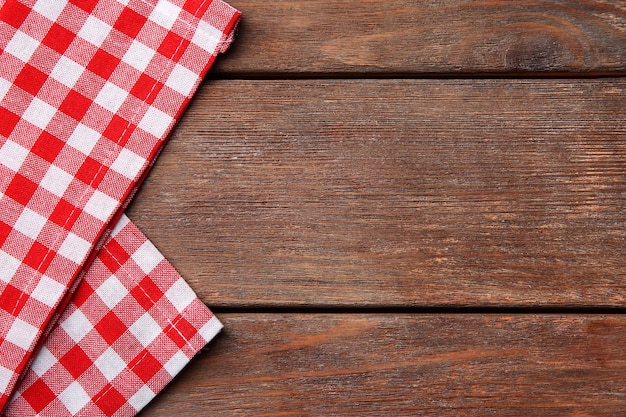 Red napkin on wooden table