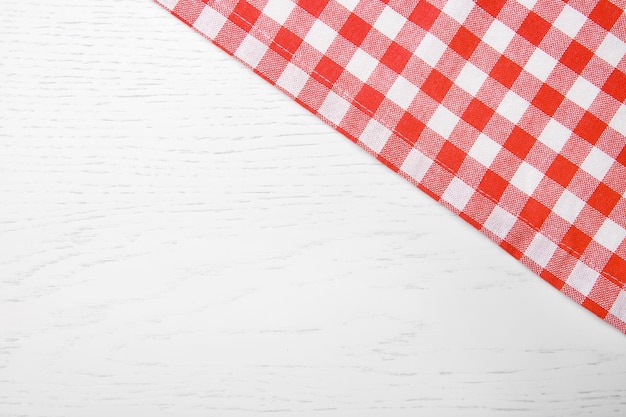 Red napkin on wooden table