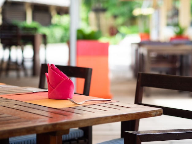 Red napkins folding in the restaurant.