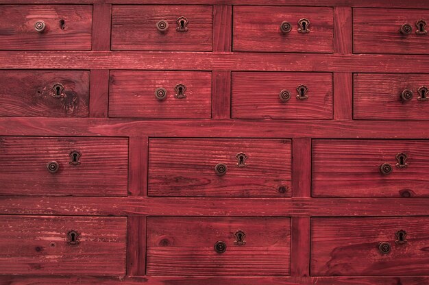 Red nightstand with drawers Each drawer is locked