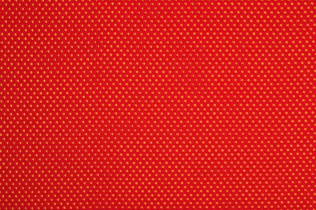 Red nonwoven fabric on a yellow background
