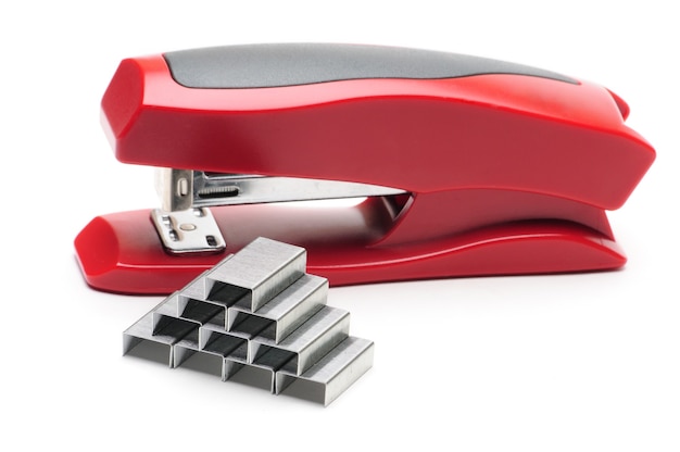 Red office stapler on an isolated white