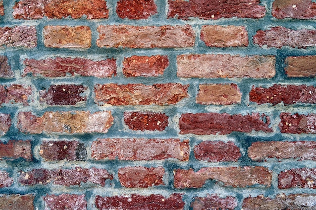 Red old worn brick wall texture background. Vintage effect.