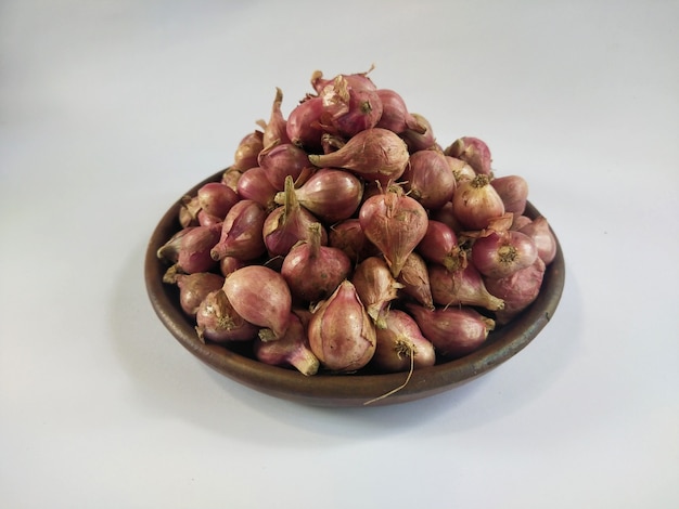 Red onion on traditional clay plate