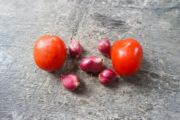 Red onions background on hand wooden hard background