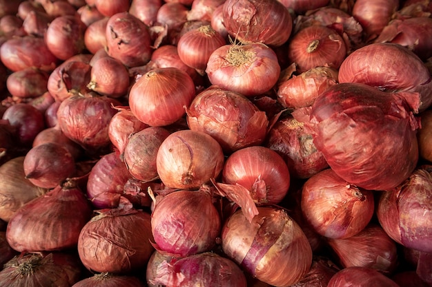 Red onions on display at a farmers market