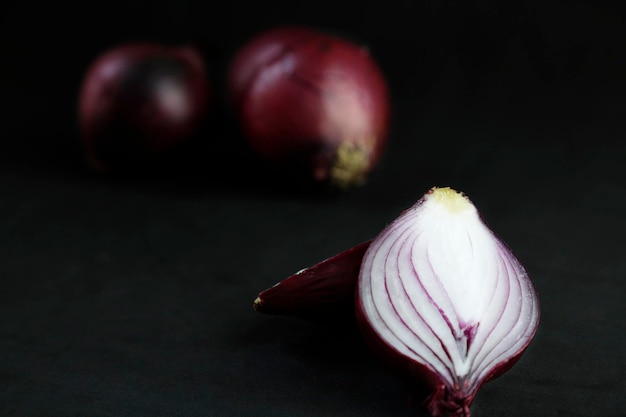 Red onions isolated on black background