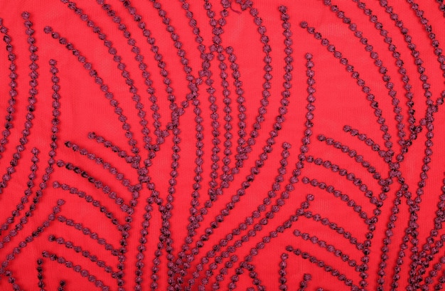 写真 背景の赤いまたは暗い色の抽象的な織物の質感