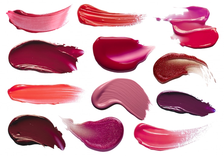 Photo red-orange purple lip gloss strokes on white background