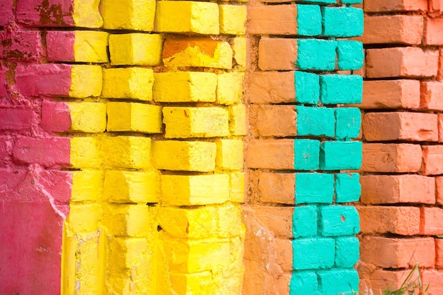 Red Orange yellow and blue color combination old Textured damage wall with Colorful Bricks