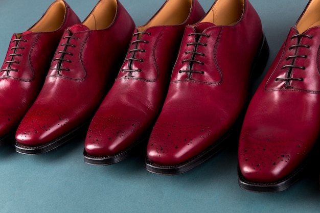 Red oxford shoes on blue surface, Three pair  brogues,