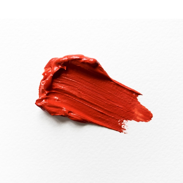 Red paint on white canvas close-up