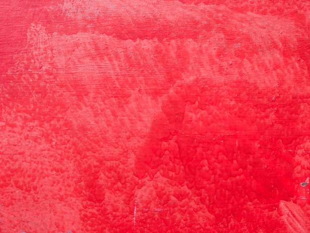 Red painted concrete wall textured abstract background