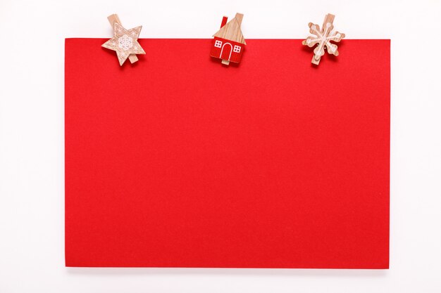 Red paper card on christmas clothes peg