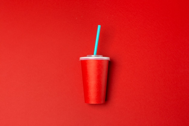 Red paper cup isolated on red,