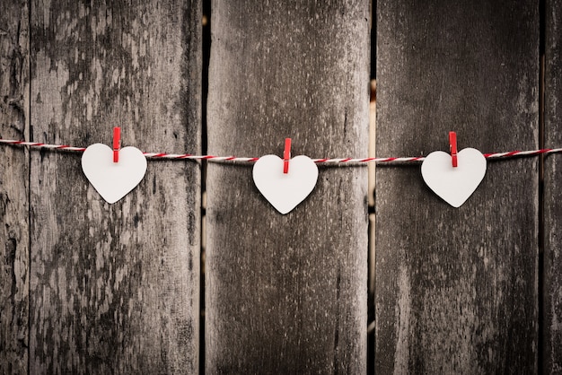 Red paper heart hanging on the clothesline