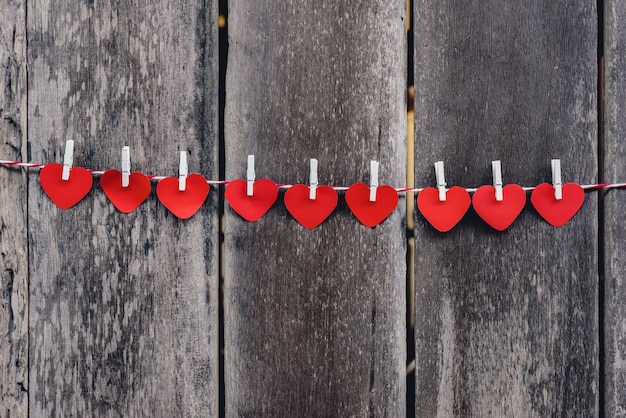 Red paper heart hanging on the clothesline