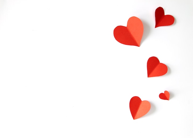 red paper hearts on white