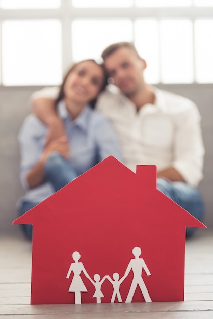 A red paper house, and beautiful couple.