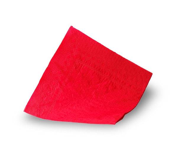 Red paper napkin carved on a white surface