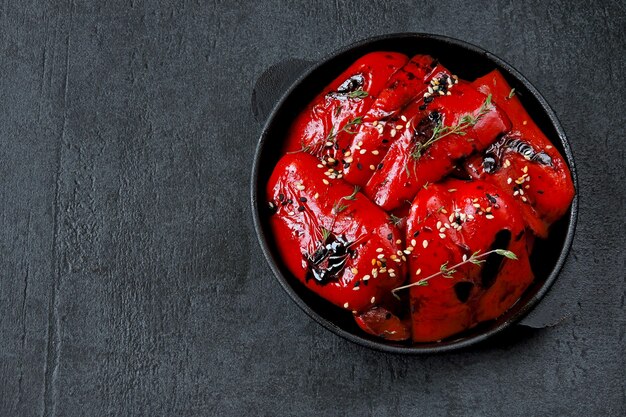 Red paprika grill in a cast iron skillet. Healthy snack. Vegan lunch