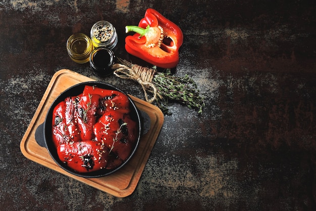 Red paprika grill in a cast iron skillet. Healthy snack. Vegan lunch