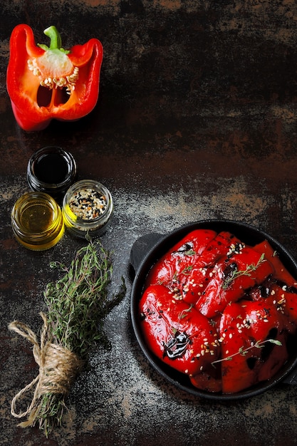 Red paprika grill in a cast iron skillet. Healthy snack. Vegan lunch