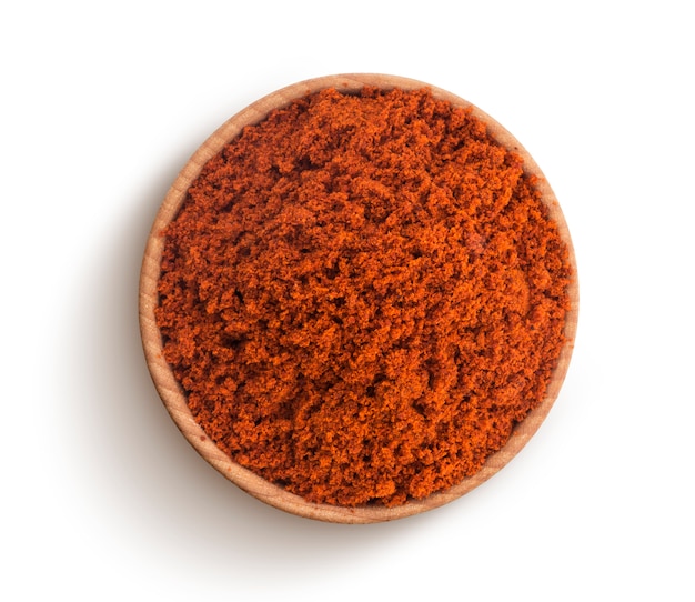 Red paprika powder isolated on white background. Top view