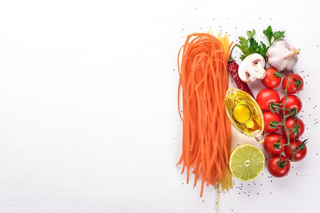 Red Pasta with Tomatoes Italian Traditional Cuisine On a wooden background Top view Copy space