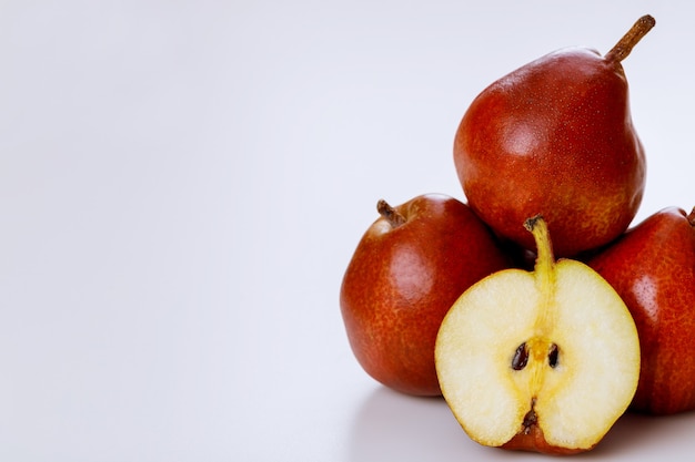 Red pears isolated on white background. Produce product.