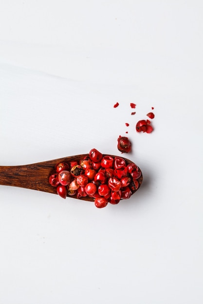 Red peas paprika on wooden spoon