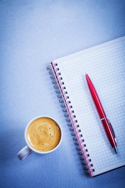 Red pen message pad white coffee cup office concept