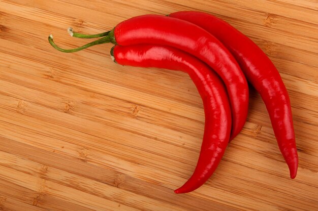 Red pepper chili on kitchen board