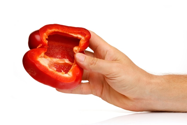 Red pepper cut in human hands isolated on white