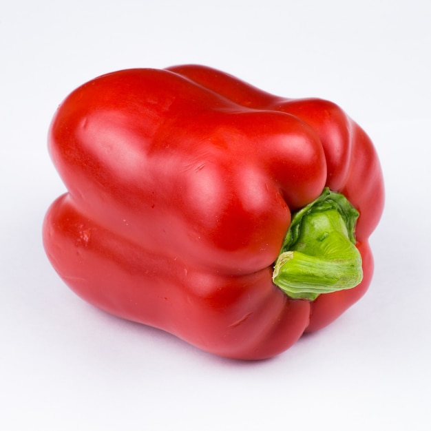 Red pepper on the white surface