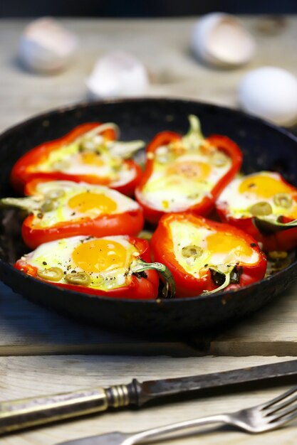 Red peppers with egg, baked in a pan