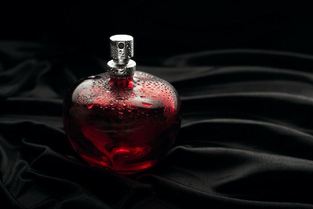 Red Perfume on black background