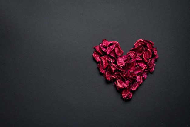 Red petals formed in the shape of a heart