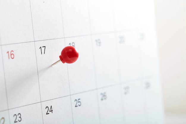 Red pin on calendar to remind