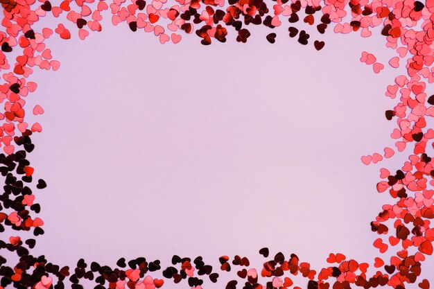 Red and pink hearts on a pink background on Valentine's Day