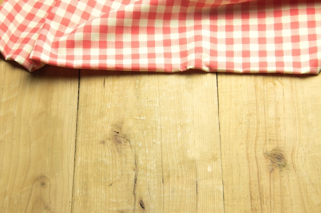 Red plaid on top view on wooden table